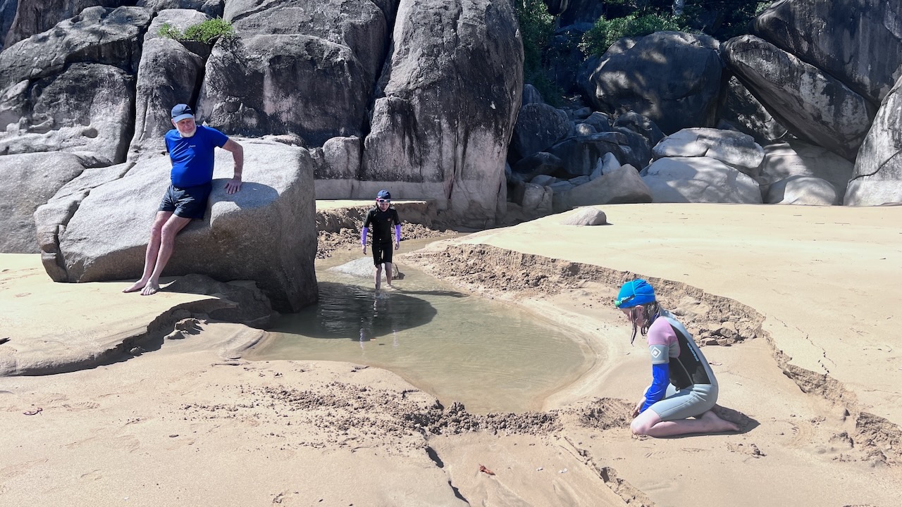The girls love a good beach creek to explore and play in