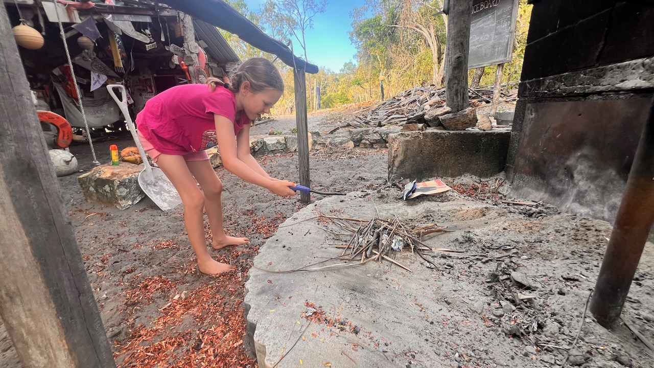 Emma helping start the fire