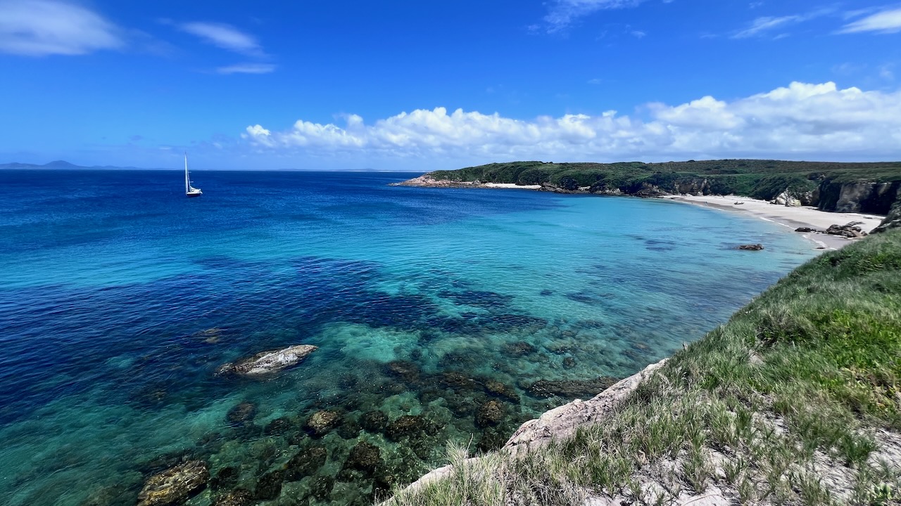 View from the cliffs half way along the bay