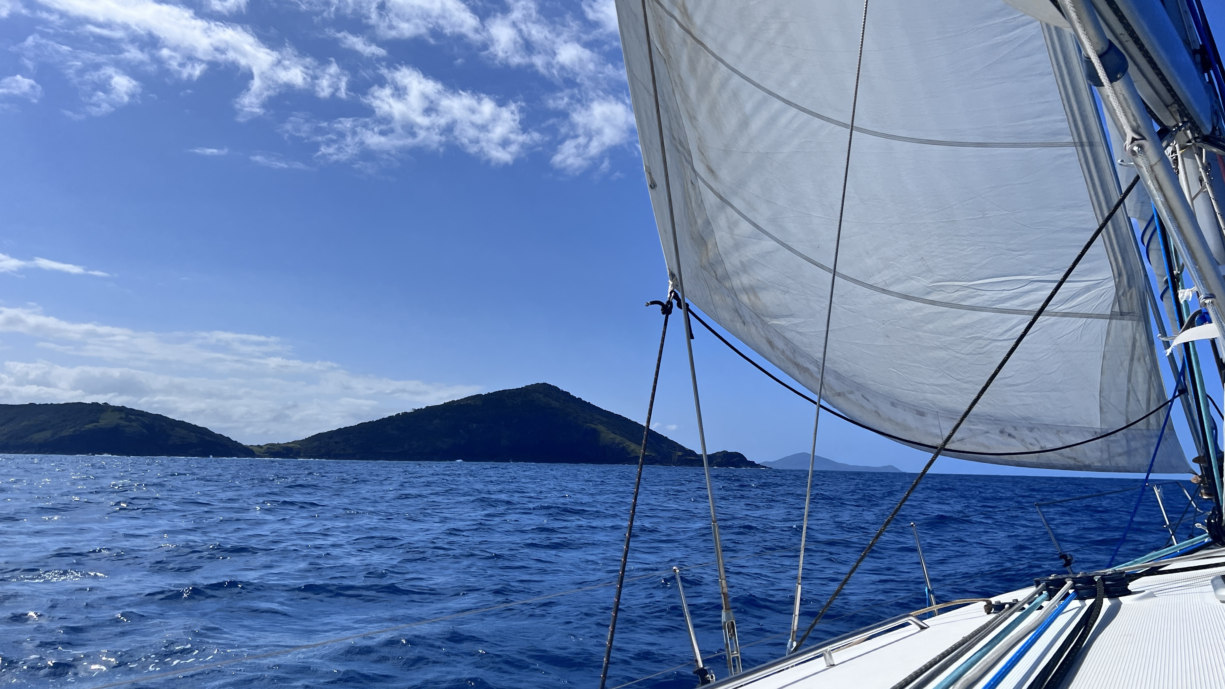 Sails up and heading past Hat Head