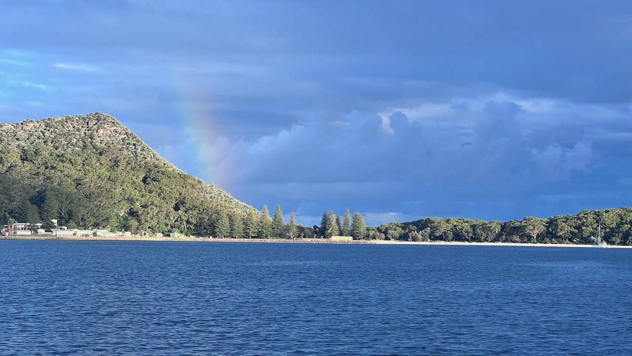 A nice rainbow over Tomaree Mountain to help us recover from the long day sailing
