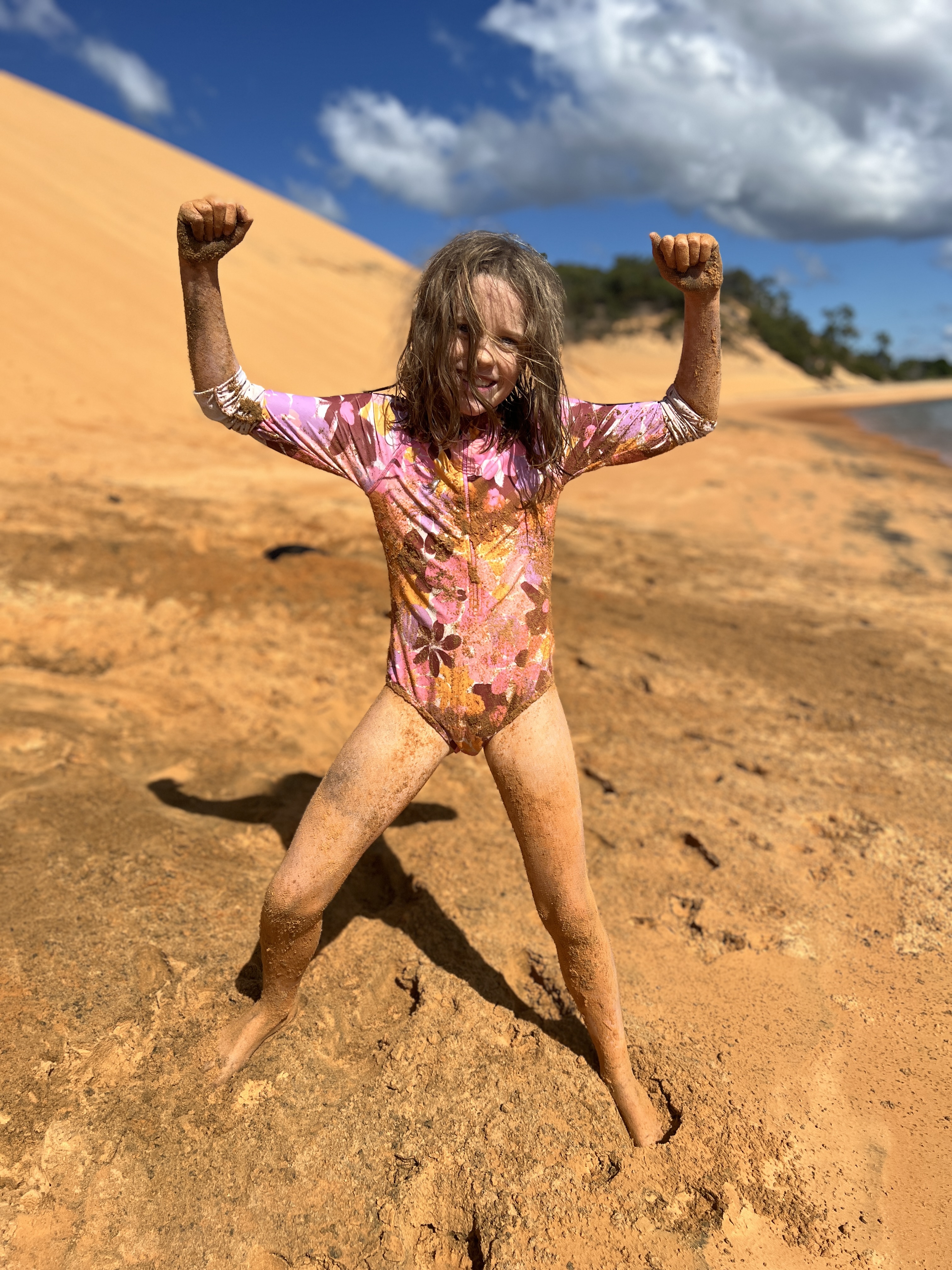 Kristina covered in the yellow sand