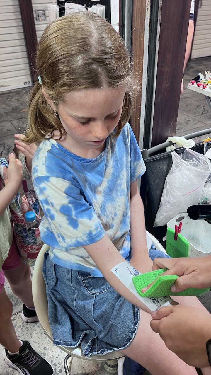 A mermaid tail coming out of a wave