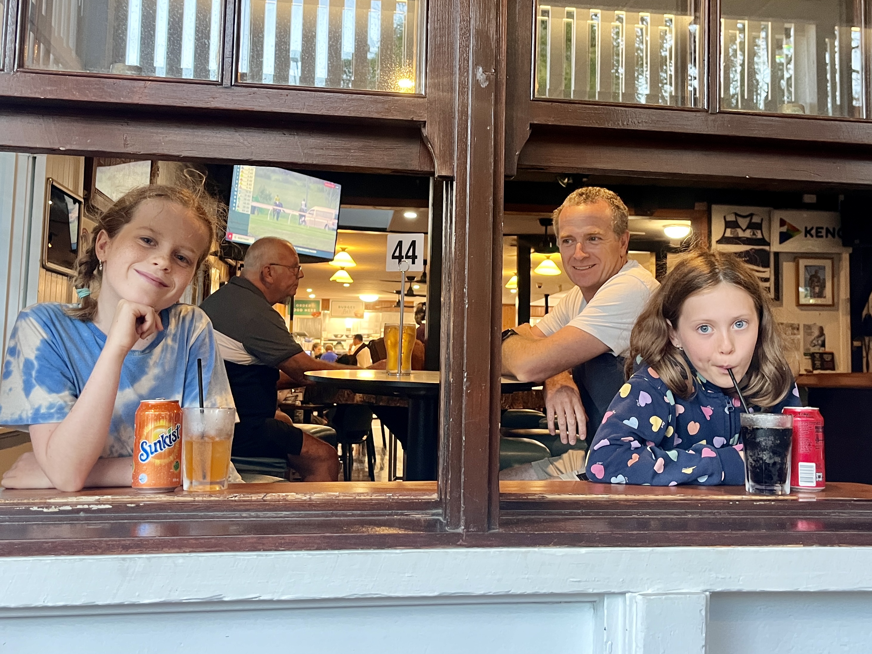 The girls chose their seats to look out the window.